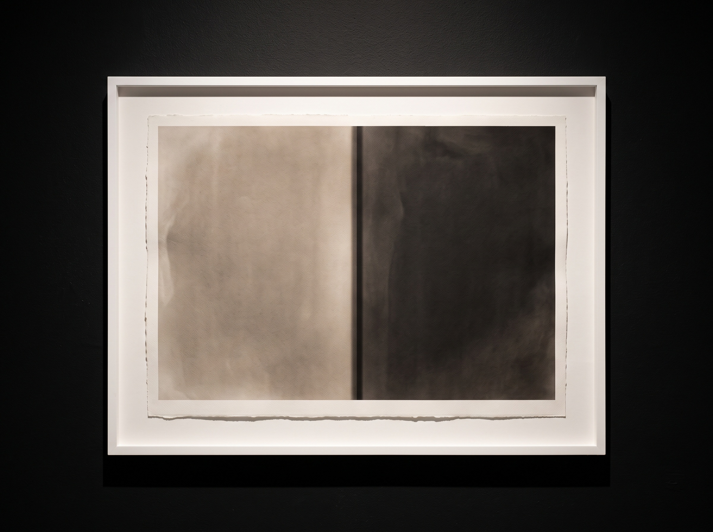 An abstract depiction of the Mach band illusion showing an exaggerated dark fringe perceived at the boundary between bright and dark tonal fields